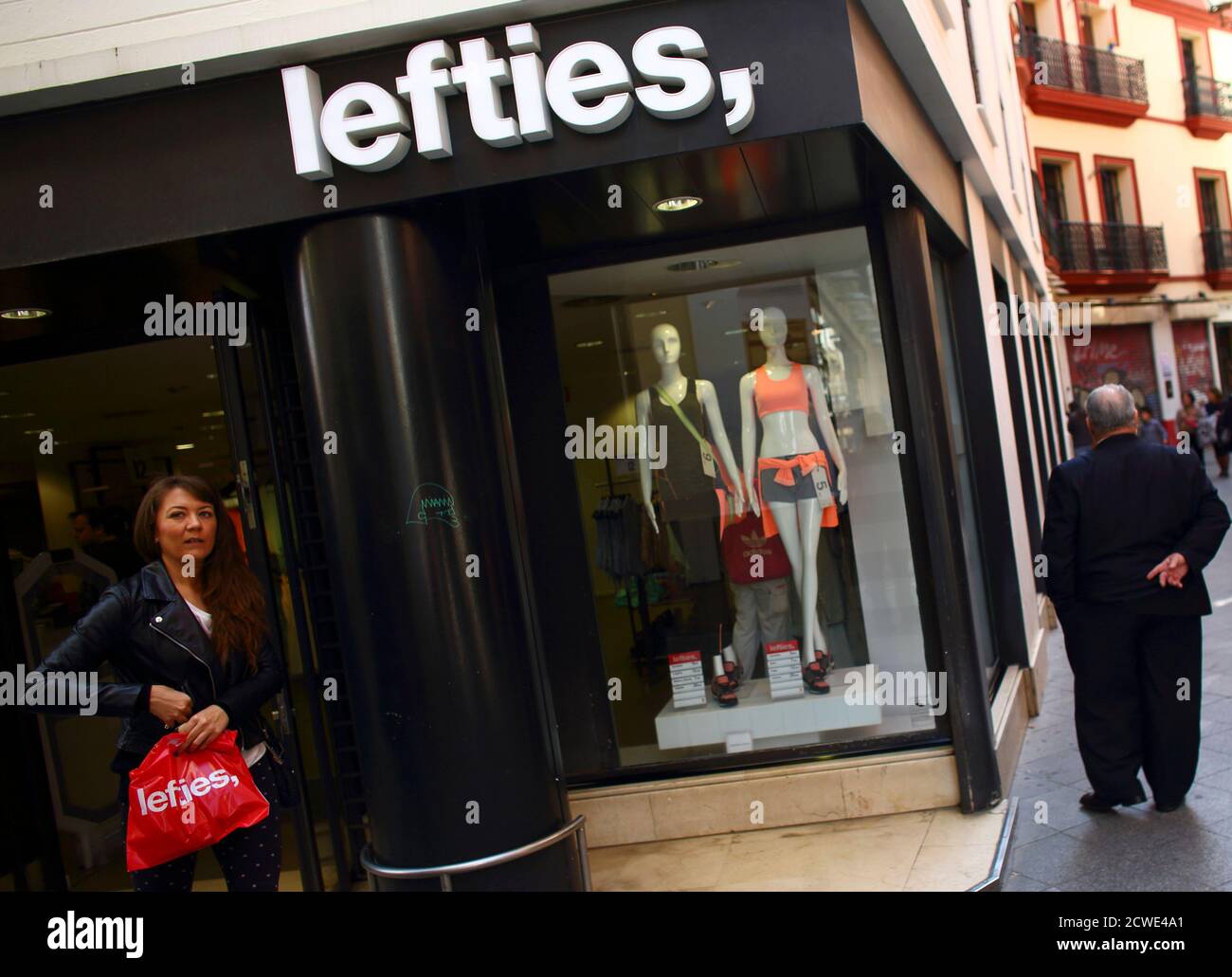 A woman leaves a Lefties store in downtown Seville, southern Spain, March  12, 2014. While Inditex's Zara and other brands have seen tepid sales  growth in Spain in recent years, the company
