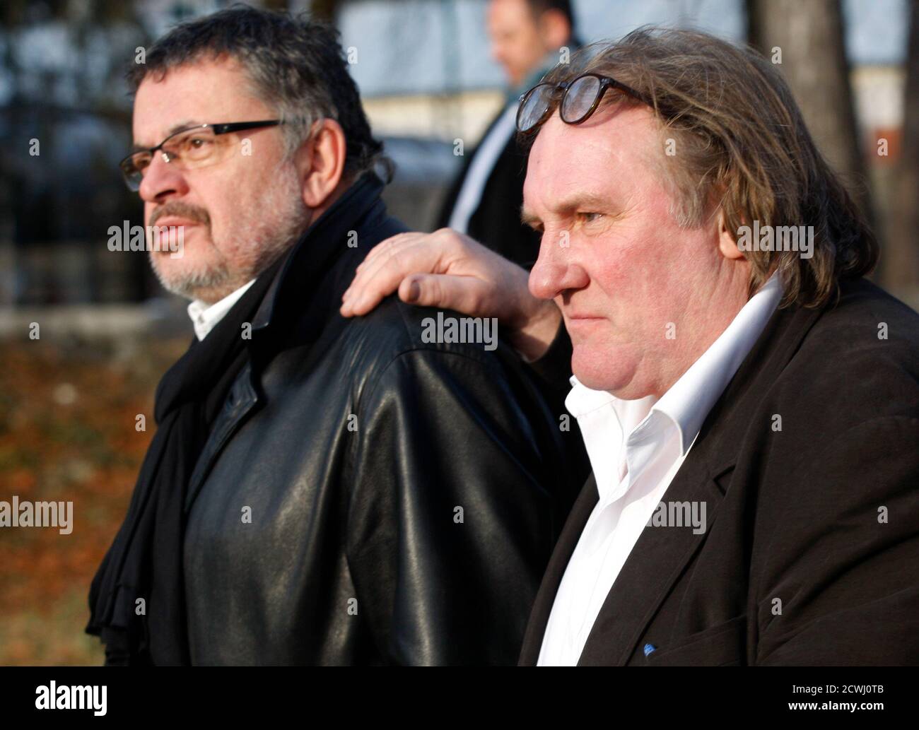 French actor Gerard Depardieu is accompanied by Branislav Micunovic,  Montenegrin Culture Minister (L) during a visit to Cetinje January 8, 2013.  Depardieu failed to show up in court to face drink driving