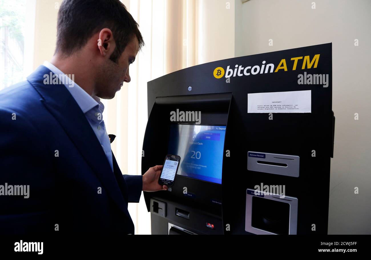 George Rotariu Uses The First Bitcoin Atm In Downtown Bucharest June 27 14 In A Well Lit Office With Red Window Frames In Downtown Bucharest Romania S First Bitcoin Atm Attracts Many Who Until