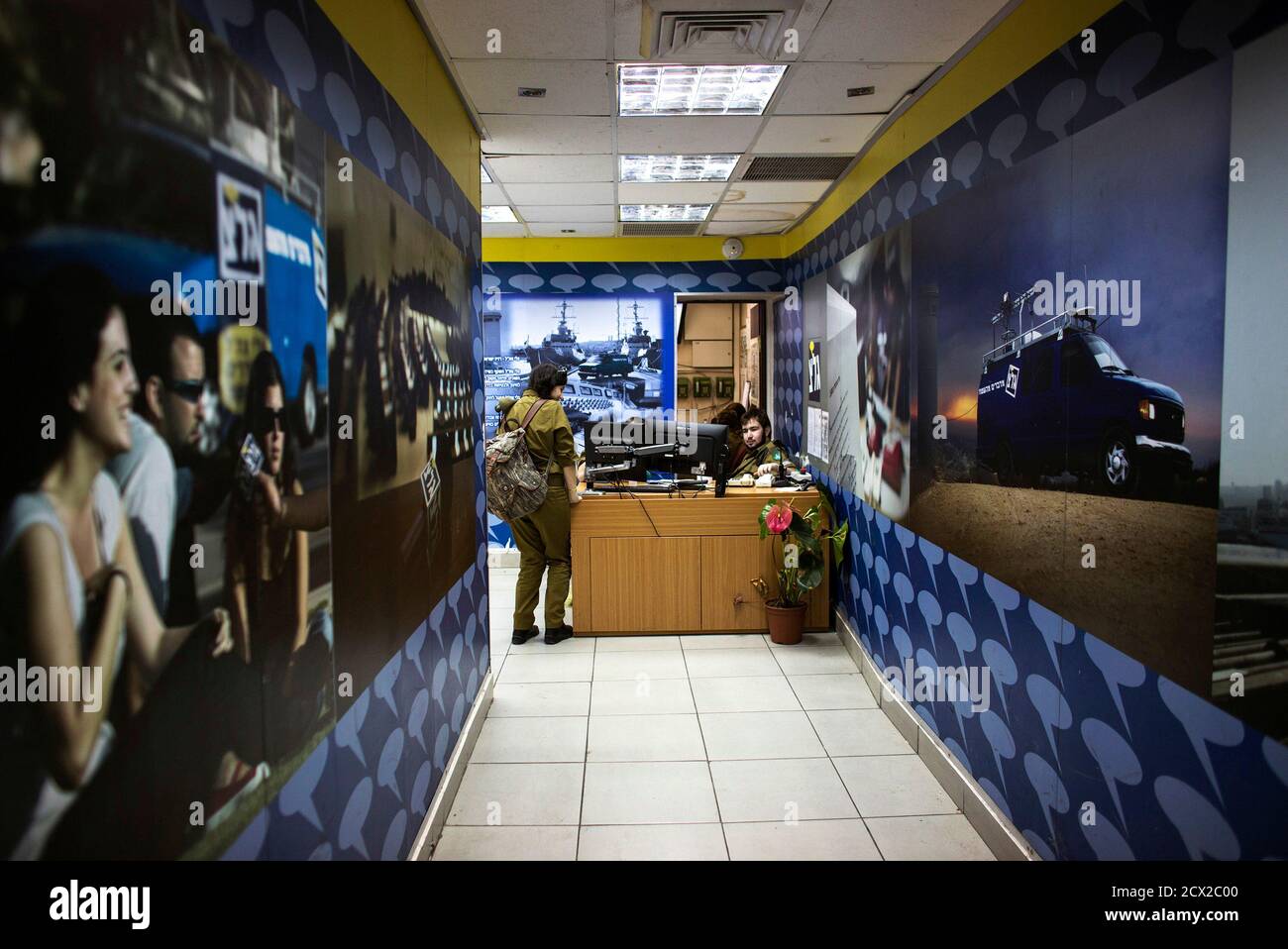 An Israeli soldier from Galei Tzahal, the Israeli army radio station,  stands at the entrance to the station's studios in Jaffa, south of central Tel  Aviv November 10, 2013. The Israeli military