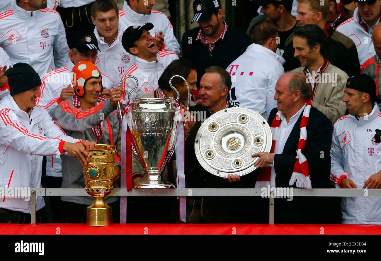 Bayern Munich S Players And Chief Executive Karl Heinz Rummenigge 3r And President Uli Hoeness 2r Hold Up German Soccer Cup Dfb Pokal Champions League And German Soccer Championship Bundesliga Trophies As They Stand