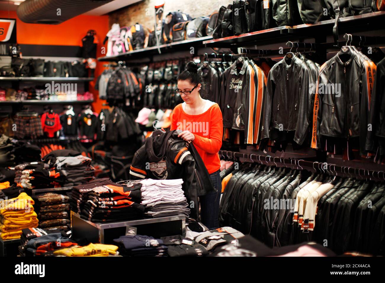 A Woman Looks At A Jacket In The Harley Davidson Manhattan Store In New York December