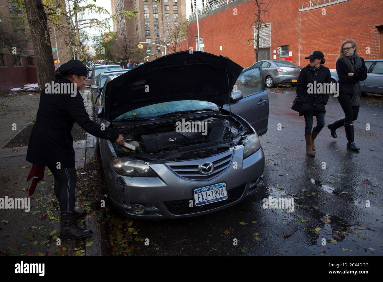A Woman Inspects Her Destroyed Car In Manhattan After The Storms From Last Night S Hurricane Sandy In New York October 30 2012 Millions Of People Across The Eastern United States Awoke On