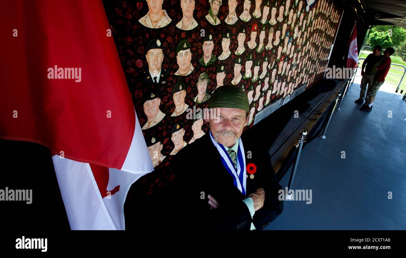 Artist Dave Sopha Stands With A Mural That He Painted Of The Canadian Armed Forces Members That Have Died During Their Mission To Afghanistan At The Canadian National Air Force Museum In