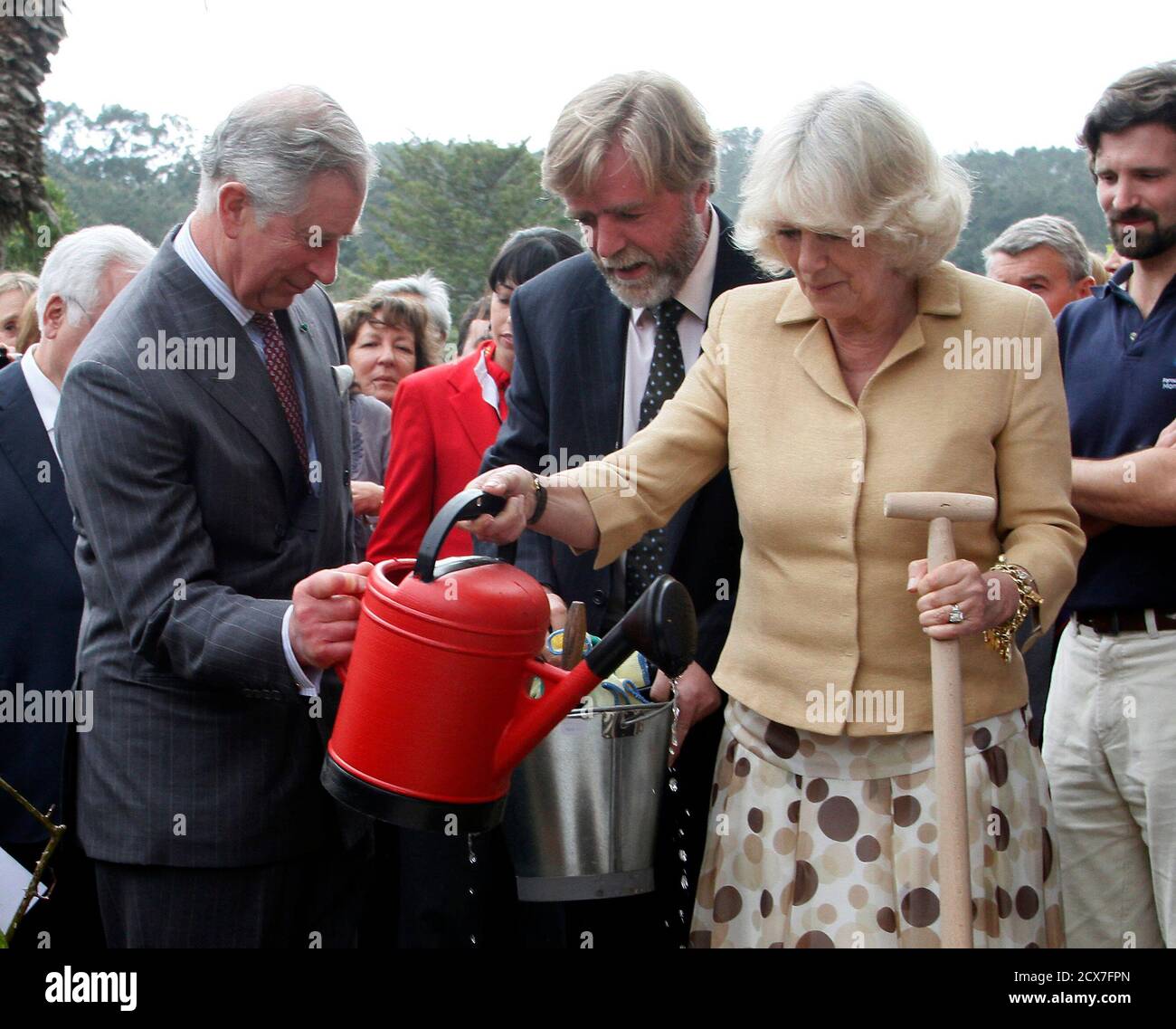 britains-prince-charles-l-and-his-wife-camilla-2nd-r-the-duchess-of-cornwall-plant-a-rose-at-the-monserrate-palace-in-sintra-march-29-2011-prince-charles-and-his-wife-camilla-the-duchess-of-cornwall-are-on-a-three-day-official-visit-to-portugal-reuters-hugo-correia-portugal-tags-politics-royals-2cx7fpn.jpg
