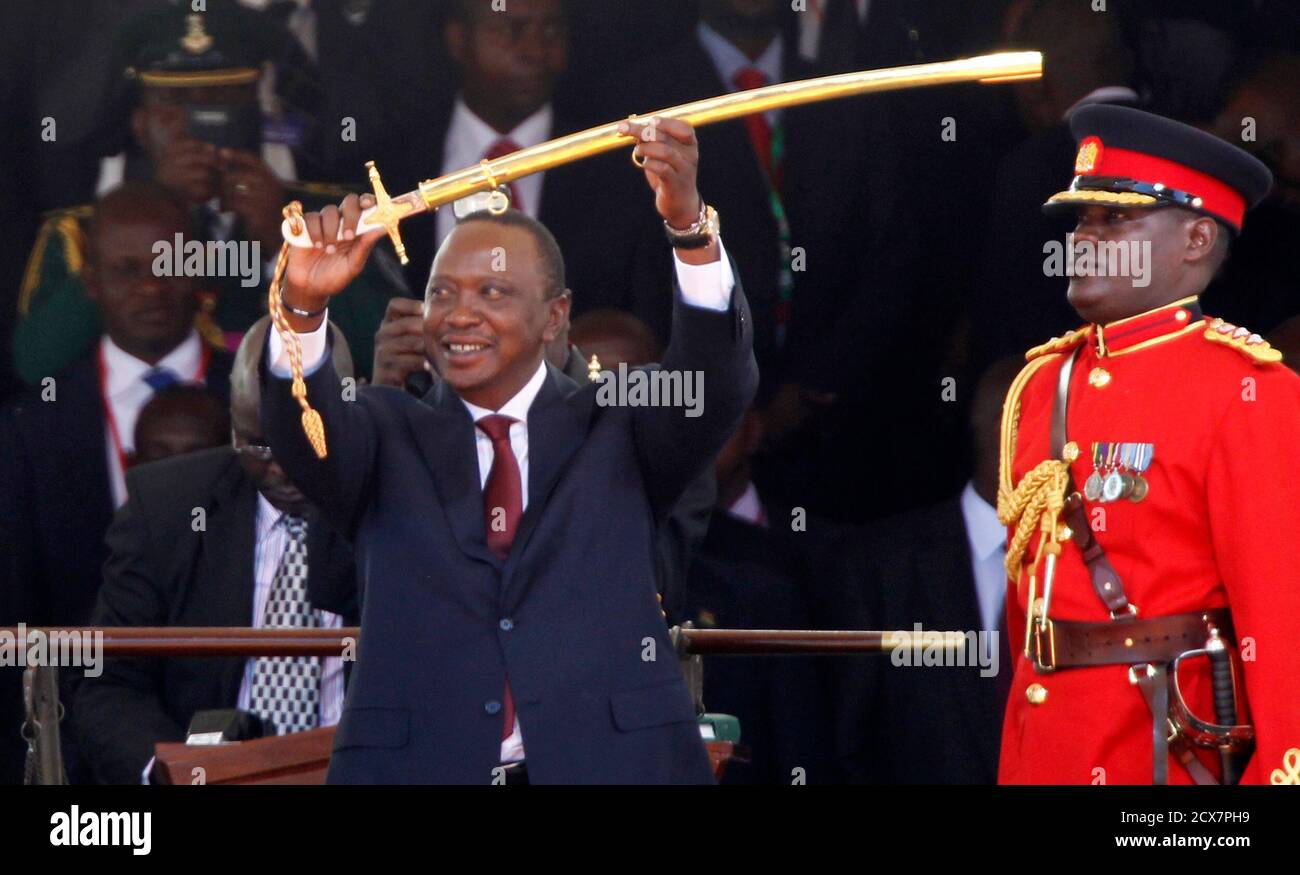 Kenya S President Uhuru Kenyatta Displays A Special Sword That He Received To Represent The Instrument Of His Power And Authority From His Predecessor Mwai Kibaki Not In The Picture After His Official