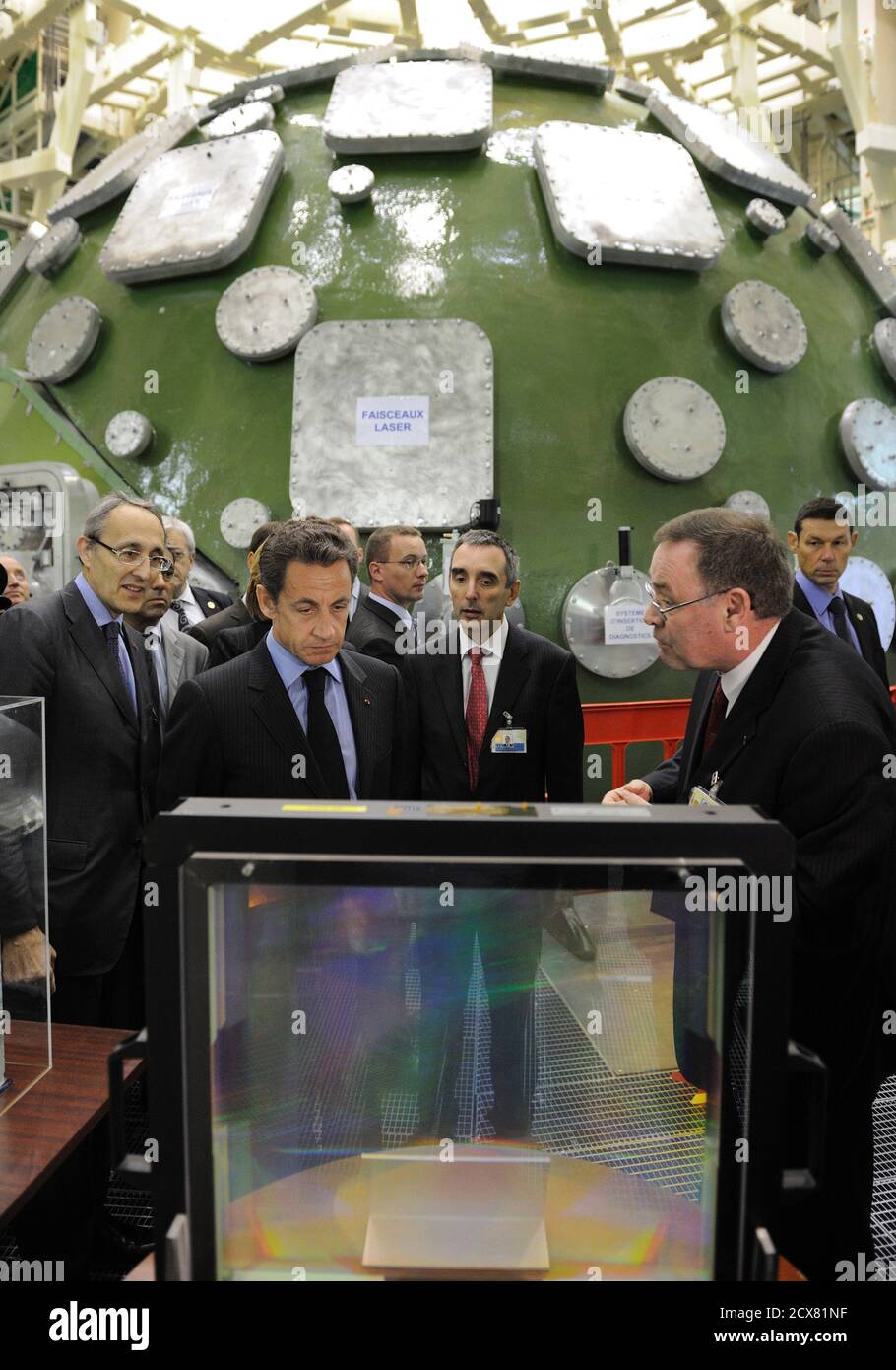 France's President Nicolas Sarkozy (2nd L) listens the CEA site director  Daniel Verwaerde (R) as he visits the experience of the Megajoule Laser  (LMJ) project of the French Atomic Energy and Alternative