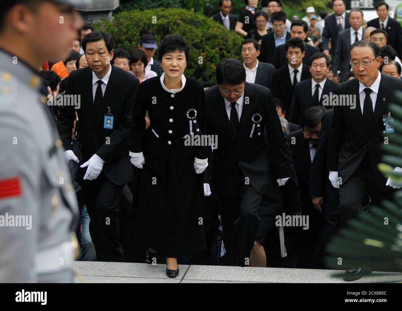 Park Geun Hye 3rd R And Her Brother Park Ji Man 2nd R Walk To Attend A Memorial Service For Their Mother And The Late First Lady Yuk Young Soo At The National Cemetery In