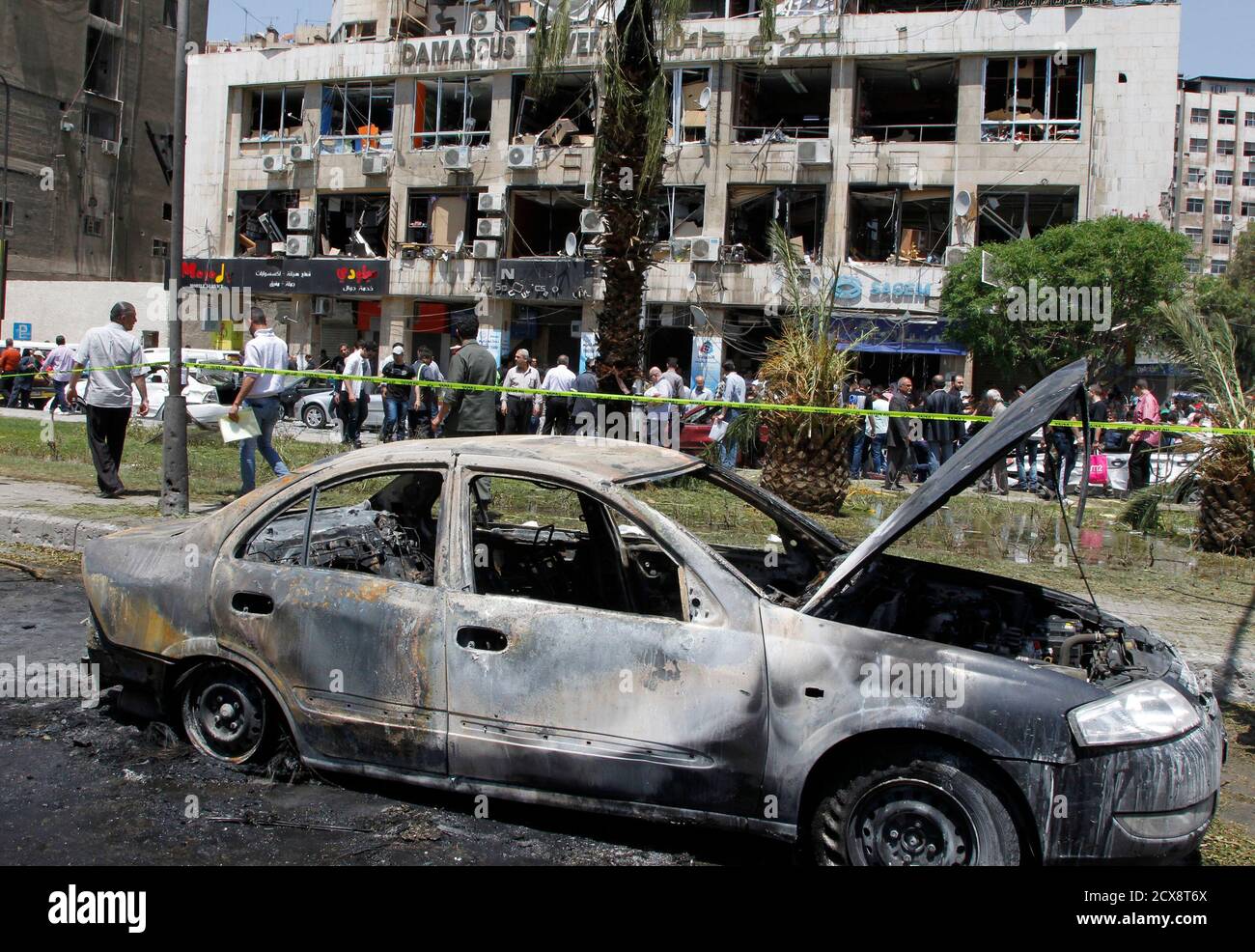 A Destroyed Car Is Pictured Near A Damaged Building After A Blast At Marjeh Square In Damascus April 30 2013 The Bomb In Central Damascus Killed 13 People On Tuesday State Television
