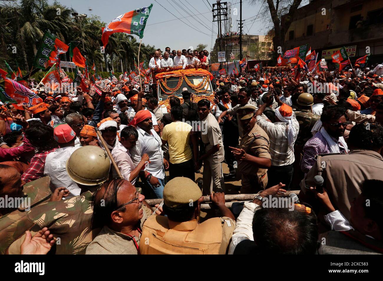 Police try to clear the way for Hindu nationalist Narendra Modi, prime  ministerial candidate for India's main opposition Bharatiya Janata Party ( BJP), as he arrives to file his nomination papers for the