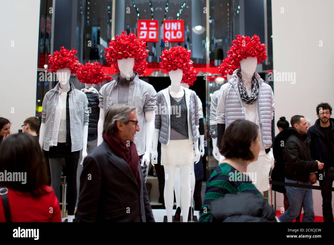 People visit the Uniqlo Global flagship store during a preopening in Berlin,  April 10, 2014. Japanese casual wear chain Uniqlo opens its first store in  Germany on Friday, as it accelerates expansion