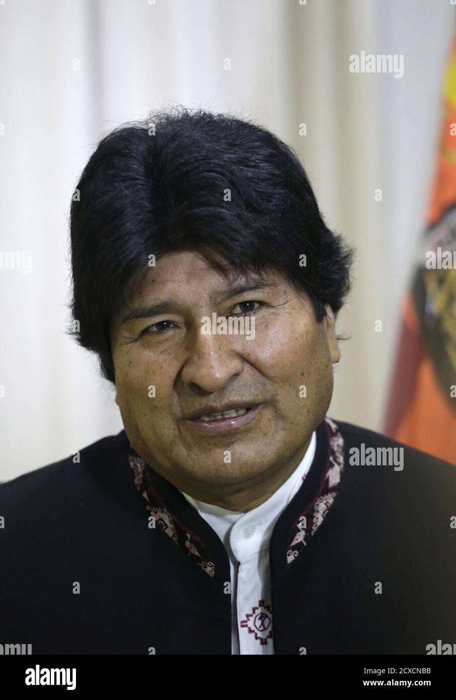 Bolivia's President Evo Morales (C) talks with Aymara indigenous people  during a ceremony in Tiawanacu, about 70 km (43 miles) north of La Paz,  October 11, 2006. Representatives of indigenous groups from