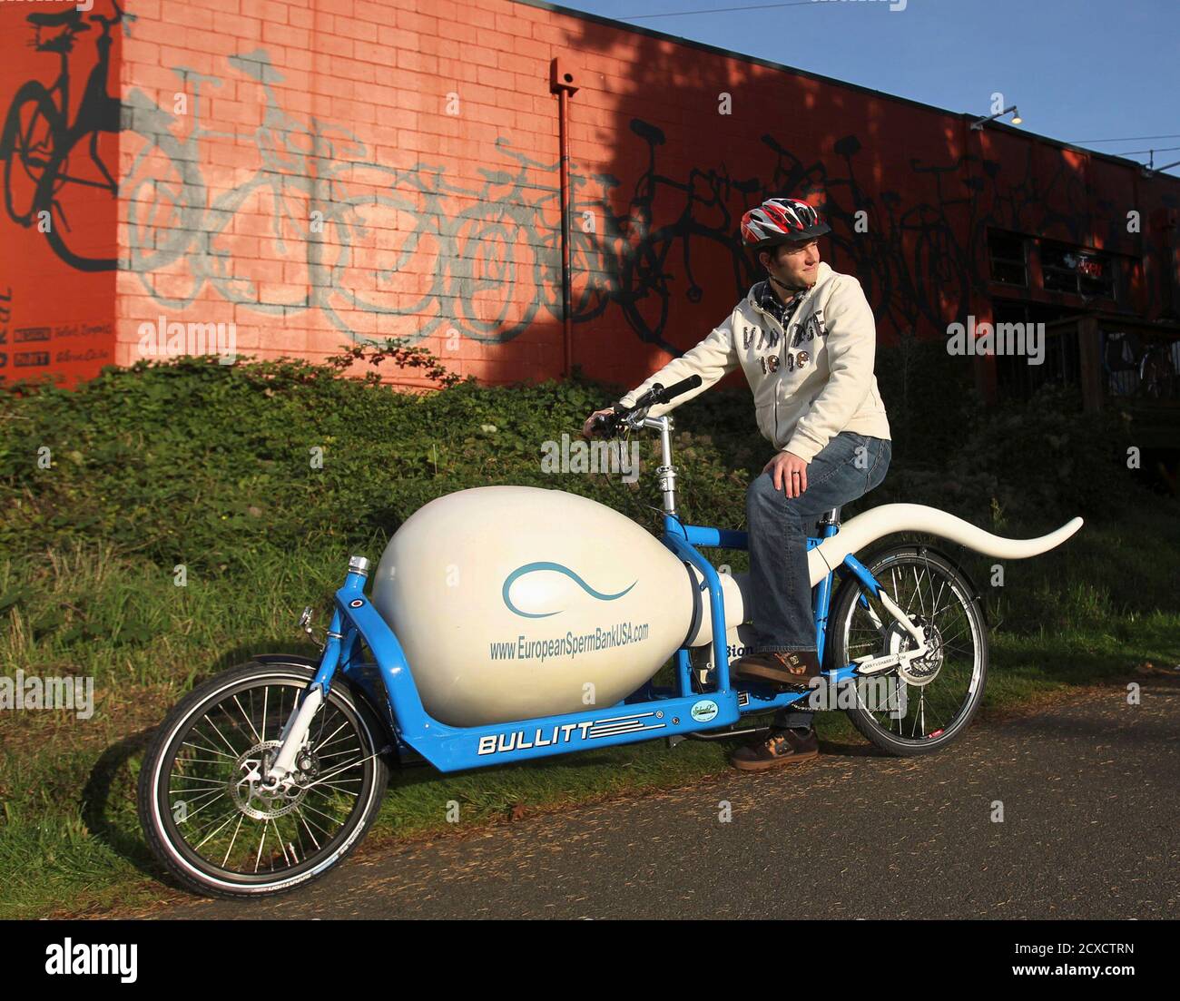 Biological analyst Alan Dowden of the Seattle Sperm Bank takes a break from  riding the Sperm Bike, a custom-designed, high-tech bicycle used to deliver  donated sperm to fertility clinics, in Seattle November