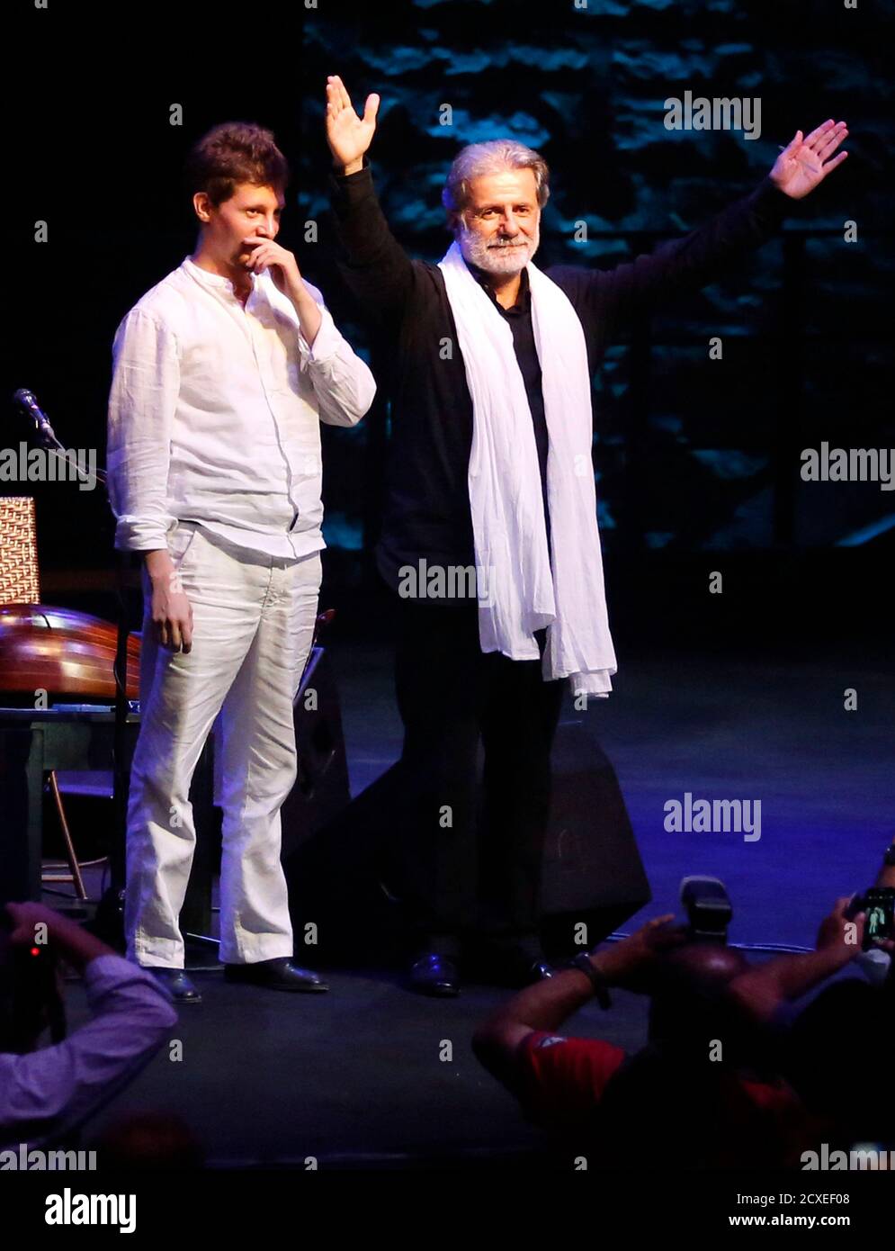 Lebanese composer and singer Marcel Khalife gestures next to cello player  Sari Khalife during the Baalbek festival, which was held in La Magnanerie,  a 19th century silk factory, in Beirut August 24,