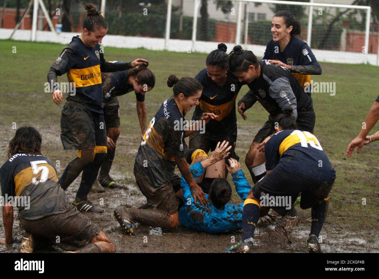Players from Boca Juniors women's soccer club celebrate after beating  Excursionistas to win their third league championship title in Buenos Aires  May 11, 2014. Long on the soccer sidelines, more and more