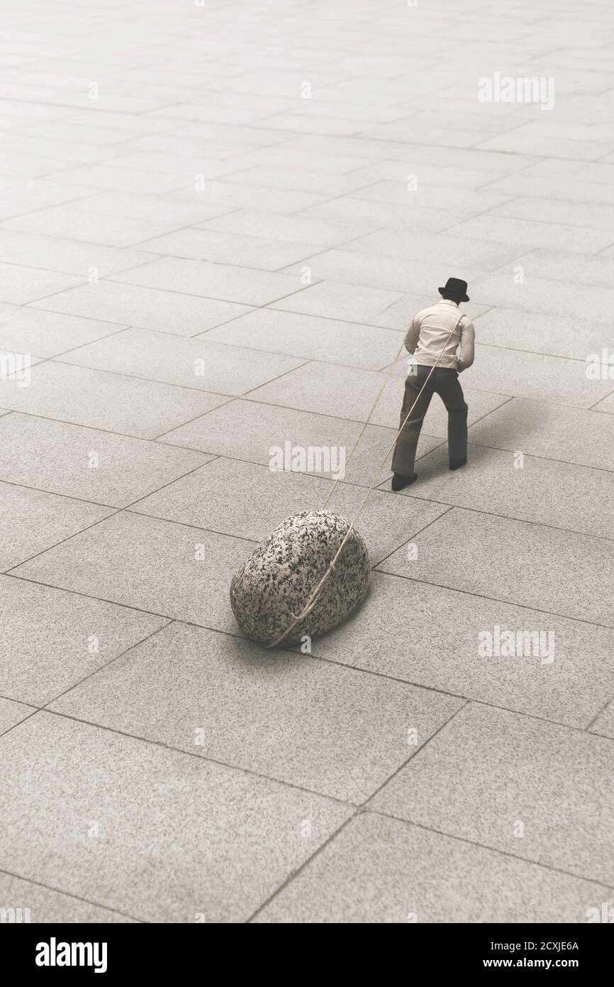 l'homme porte une pierre géante, concept de force et de succès Banque D'Images