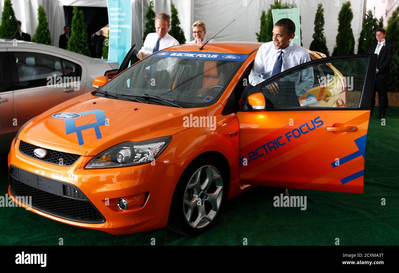 U.S. President Barack Obama gets into an electric Ford Focus as he attends  the groundbreaking of a factory for Compact Power Inc. in Holland, Michigan  July 15, 2010.Over the next couple of