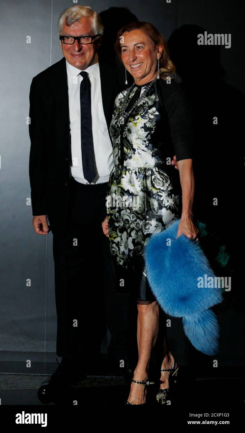 Italian fashion designer Miuccia Prada and her husband Patrizio Bertelli,  also Prada's chief executive, pose after attending a fashion show as part  of an investors launching presentation ahead of Prada's IPO in