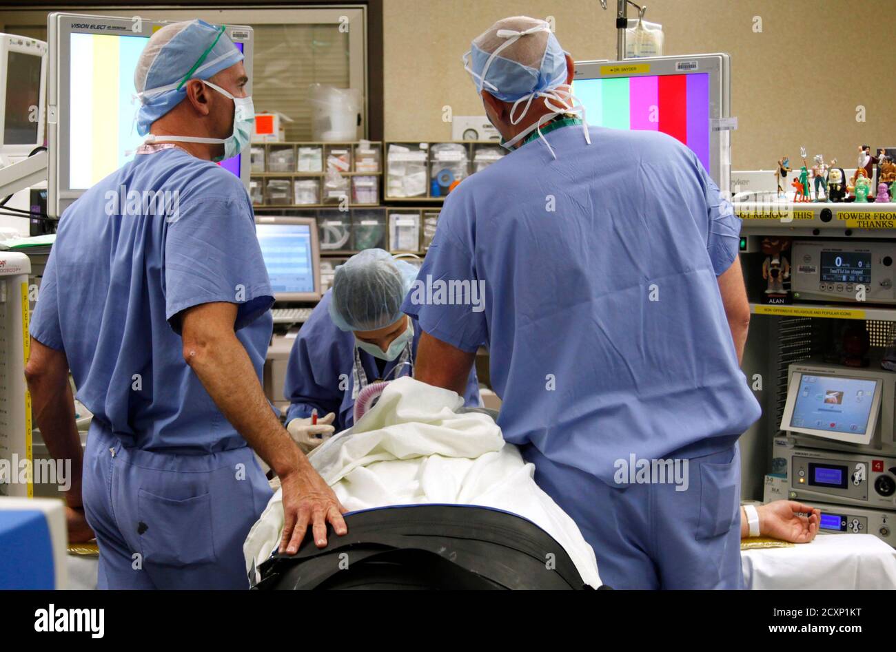 Jazmine Raygoza is prepared for Lap-Band surgery by anesthesiologist Dr.  Andrea Grilli (C) Surgical First Assistant Tony Covello (R) and Dr. Michael  Snyder (L) at Rose Medical Center in Denver June 20,