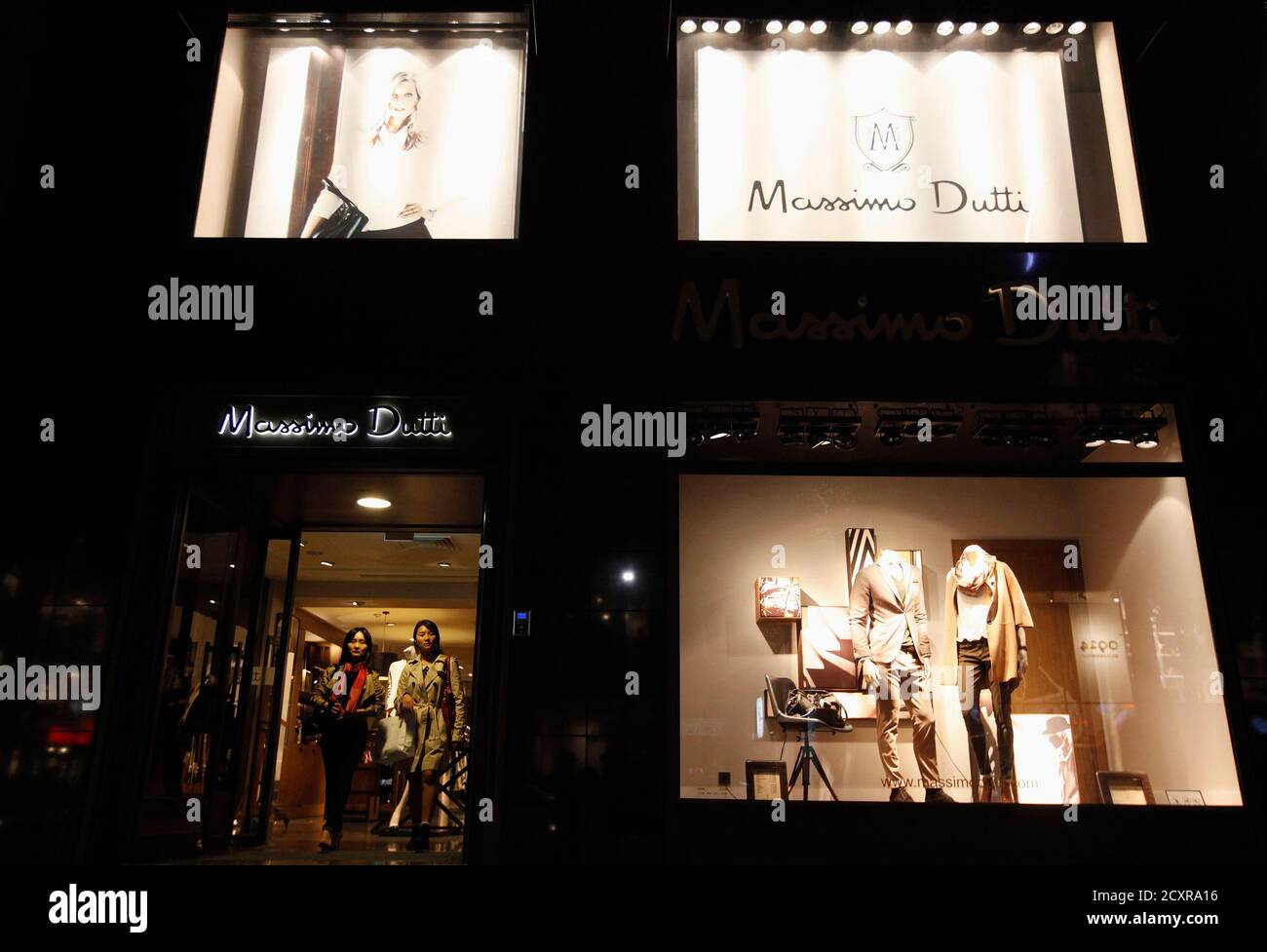 Women walk out of a Massimo Dutti clothes store on the Garosugil or the  Tree-Lined Street in the Gangnam area of Seoul October 5, 2012. Gangnam is  the most upmarket neighbourhood in