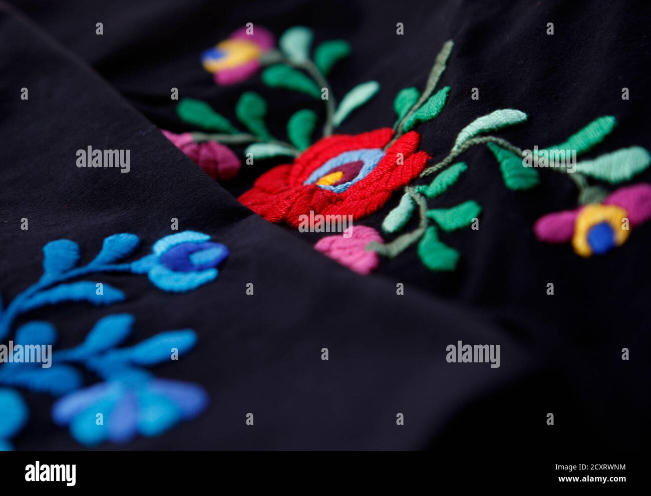 A close-up of a hand-sewn traditional pattern that local ...