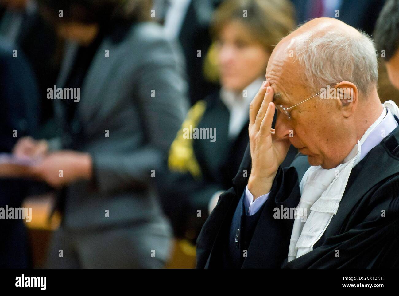 Turin prosecutor Raffaele Guariniello reacts while the President of the  court reads the verdict during the trial against the Swiss firm Eternit's  Italian plant in Turin February 13, 2012. An Italian court