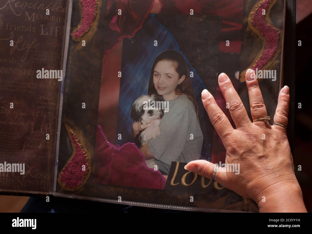 terry-dibattista-looks-over-an-album-created-in-memory-of-her-adopted-daughter-amber-rose-at-her-home-in-conway-south-carolina-march-28-2014-dibattista-and-her-former-husband-jim-rose