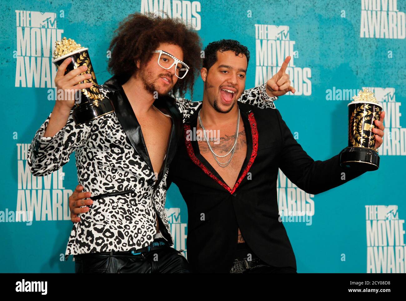 LMFAO pose with their award for best music for "Party Rock Anthem" from the  film "21 Jump Street" at the 2012 MTV Movie Awards in Los Angeles June 3,  2012. REUTERS/Danny Moloshok (
