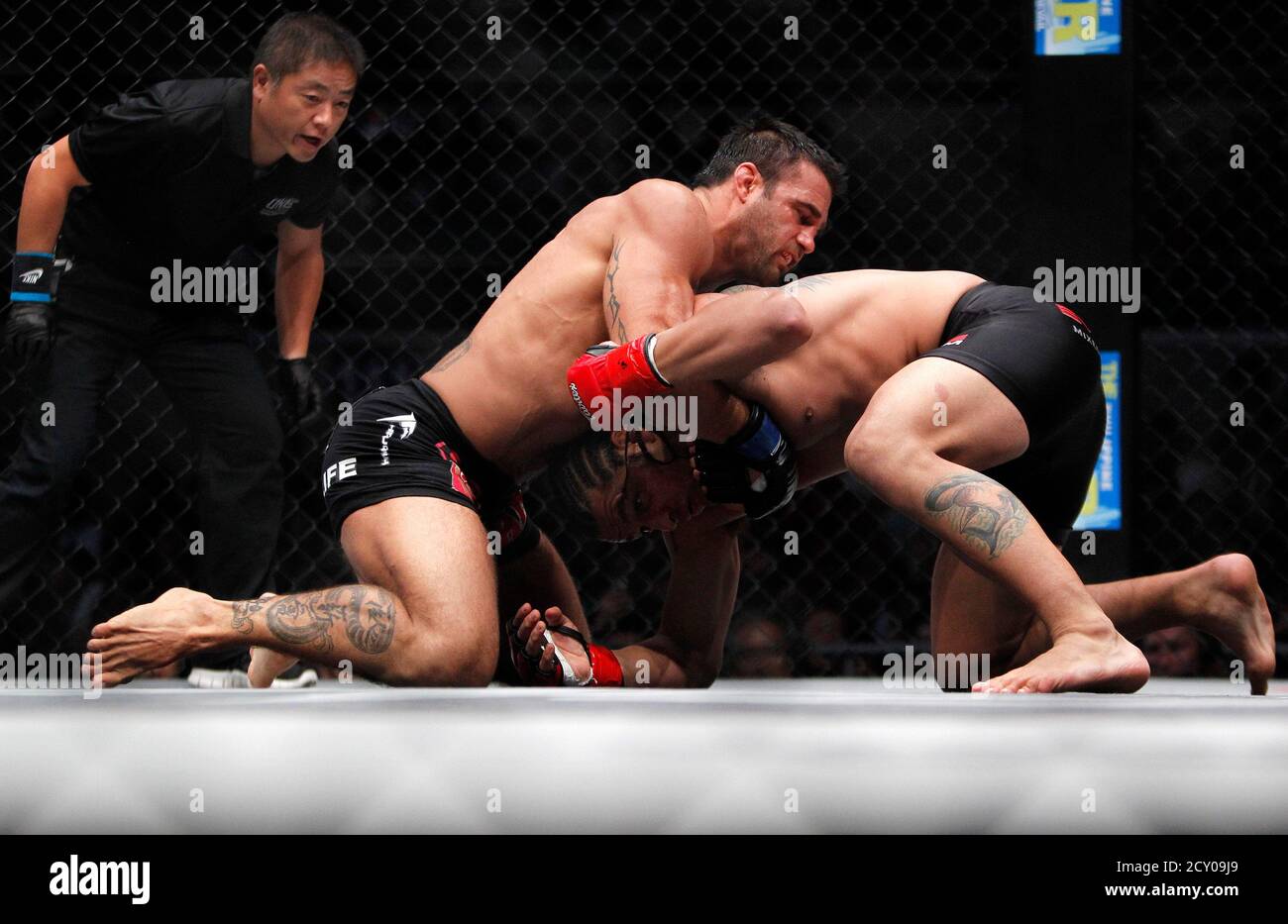 Phil Baroni of the U.S. (C) pins down Brazil's Rodrigo Ribeiro during their  ONE Fighting Championship (FC) mixed martial arts (MMA) fight at the Smart  Araneta Coliseum in Manila August 31, 2012.