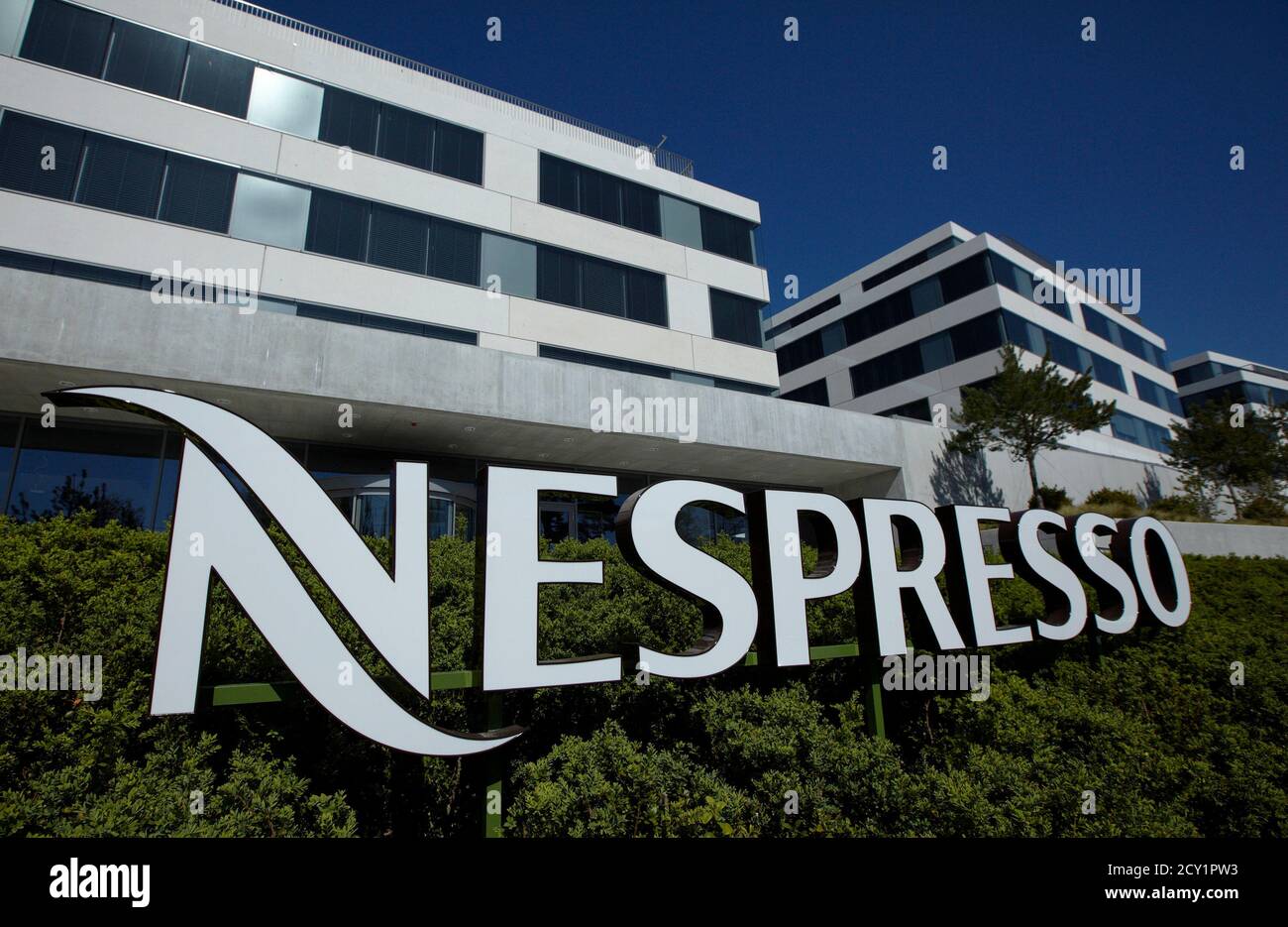 The Nespresso logo is pictured outside of the company headquarters in  Lausanne April 9, 2011. REUTERS/Denis Balibouse (SWITZERLAND - Tags:  BUSINESS Photo Stock - Alamy