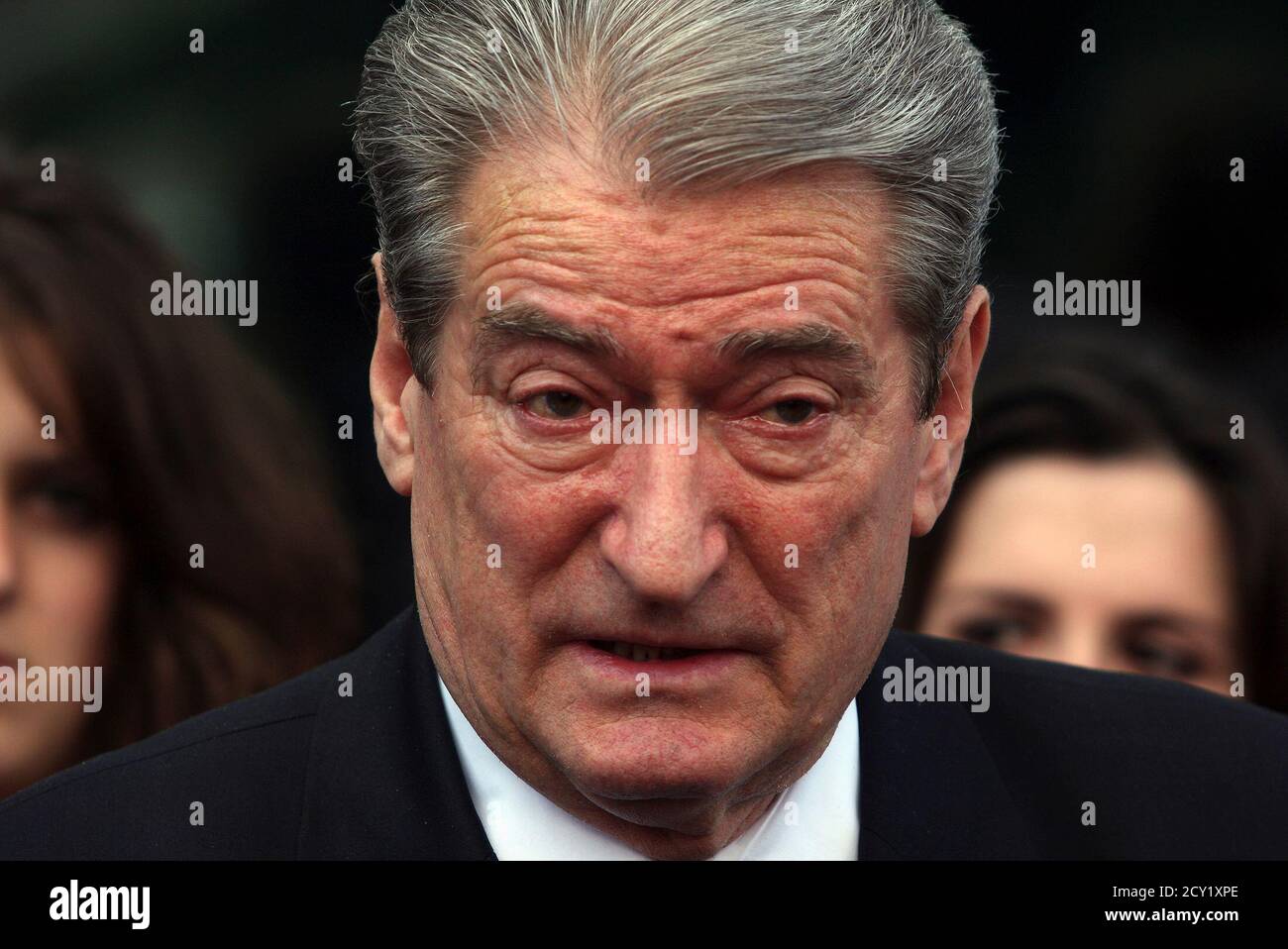 Albania S Prime Minister Sali Berisha Speaks To Journalists As His Eyes Well Up With Tears After Praying Respects To The Victims That Died In A Bus Crash On Monday In Southern Albania