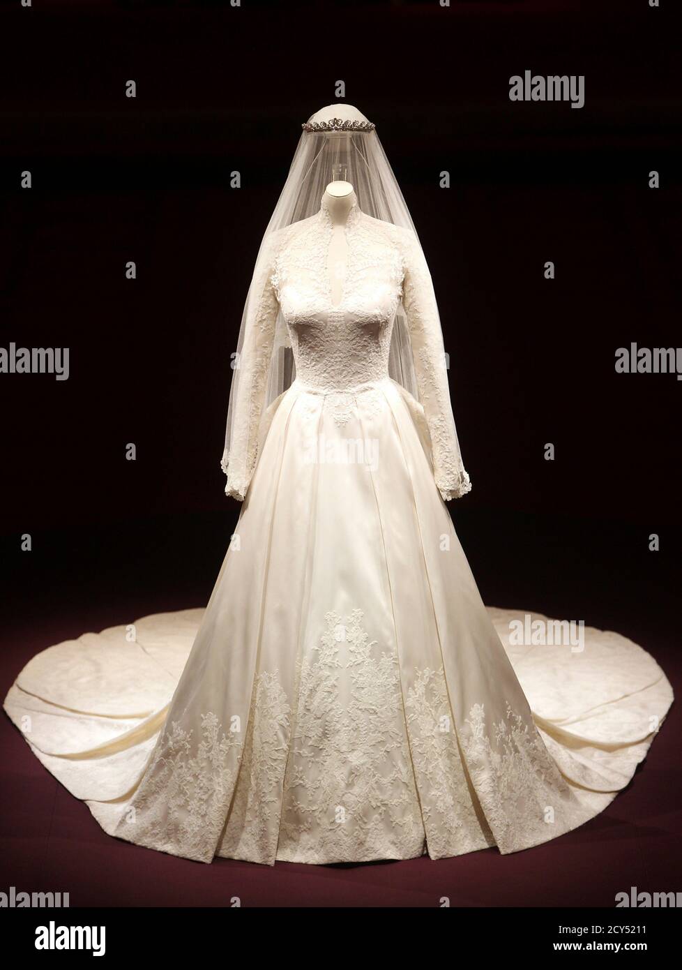 The wedding dress of Britain's Catherine, Duchess of Cambridge is seen as  it is prepared for display at Buckingham Palace in London July 20, 2011.  Buckingham Palace expects record crowds this summer