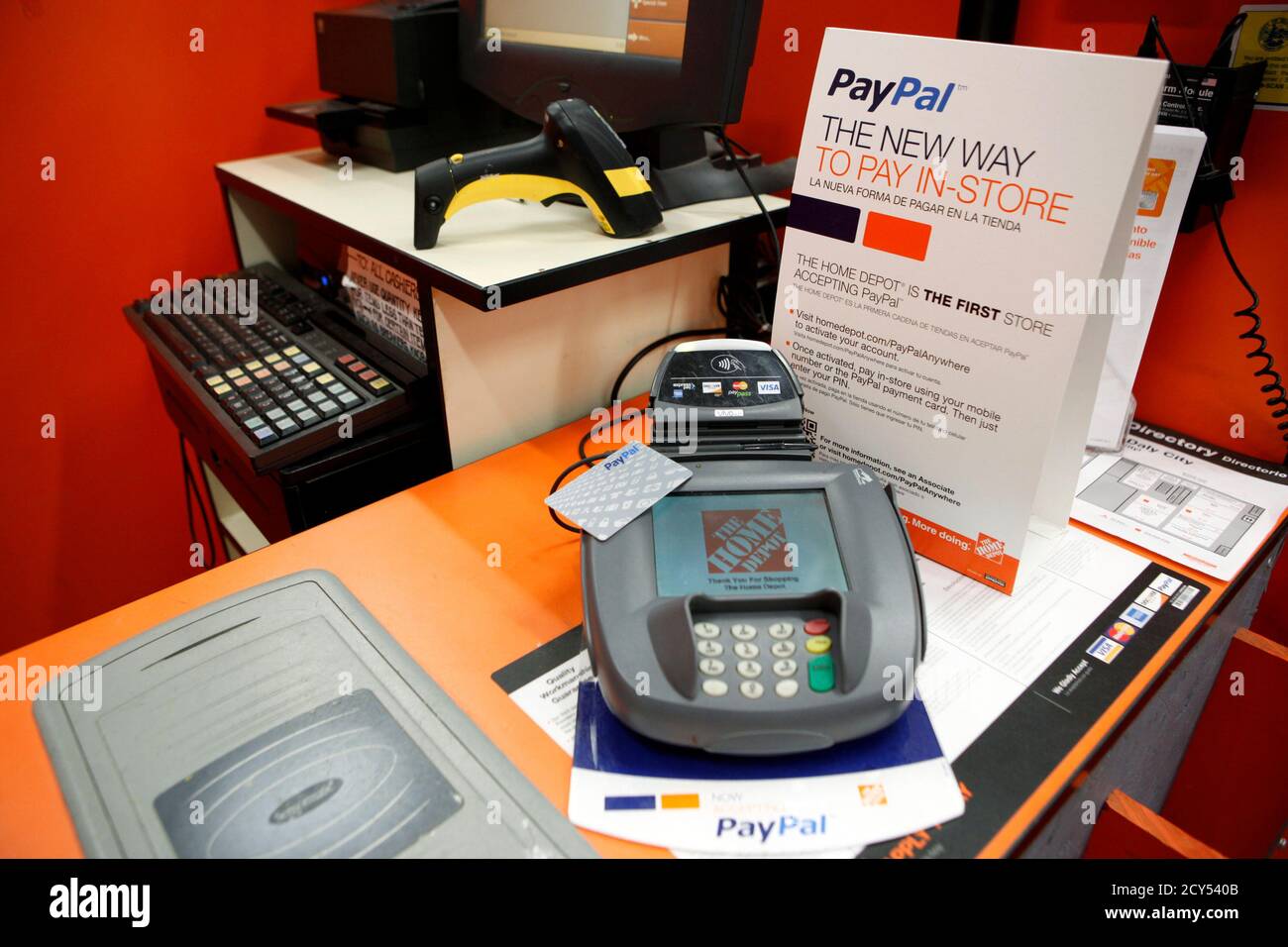 A sign showing customers' ability to now pay with their PayPal account sits  at a cashier station at a Home Depot store in Daly City, California,  February 21, 2012. EBay Inc, which
