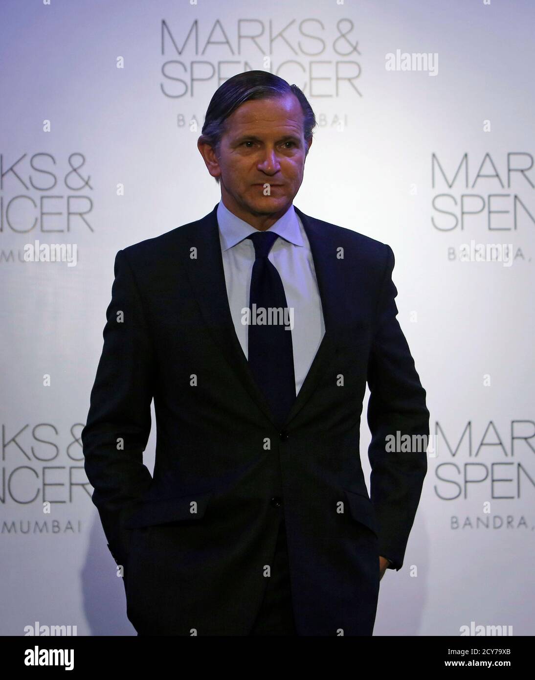 Marks & Spencer Chief Executive Marc Bolland poses for photographers at the  opening of a Marks & Spencer store in Mumbai November 11, 2013. Britain's  biggest clothing retailer Marks & Spencer wants