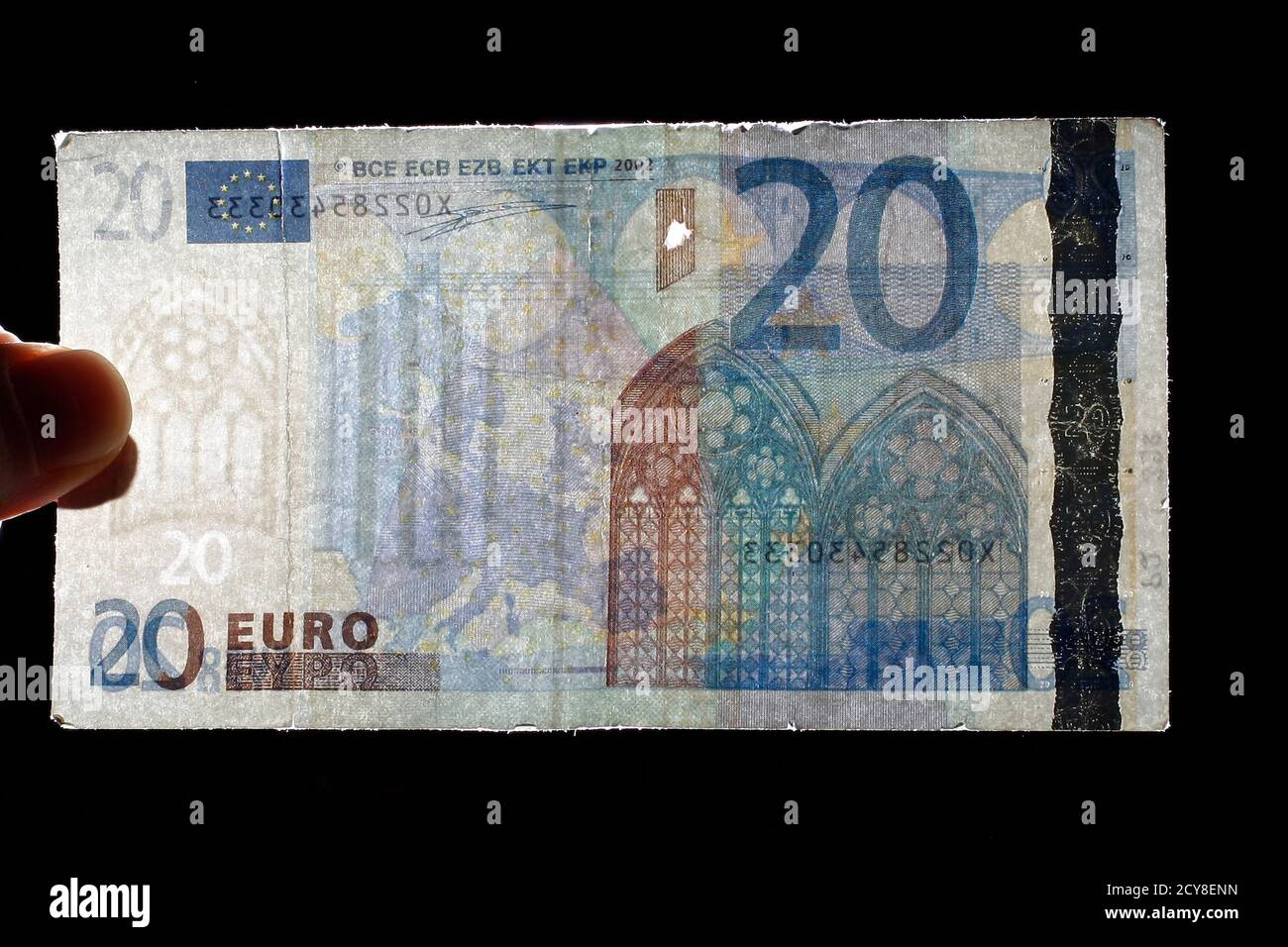 An Employee Of Austrian National Bank Oenb Shows Counterfeit Euro Banknote In Vienna January 21 11 The Value Of The Euro May Have Come Under Pressure In Recent Months But There