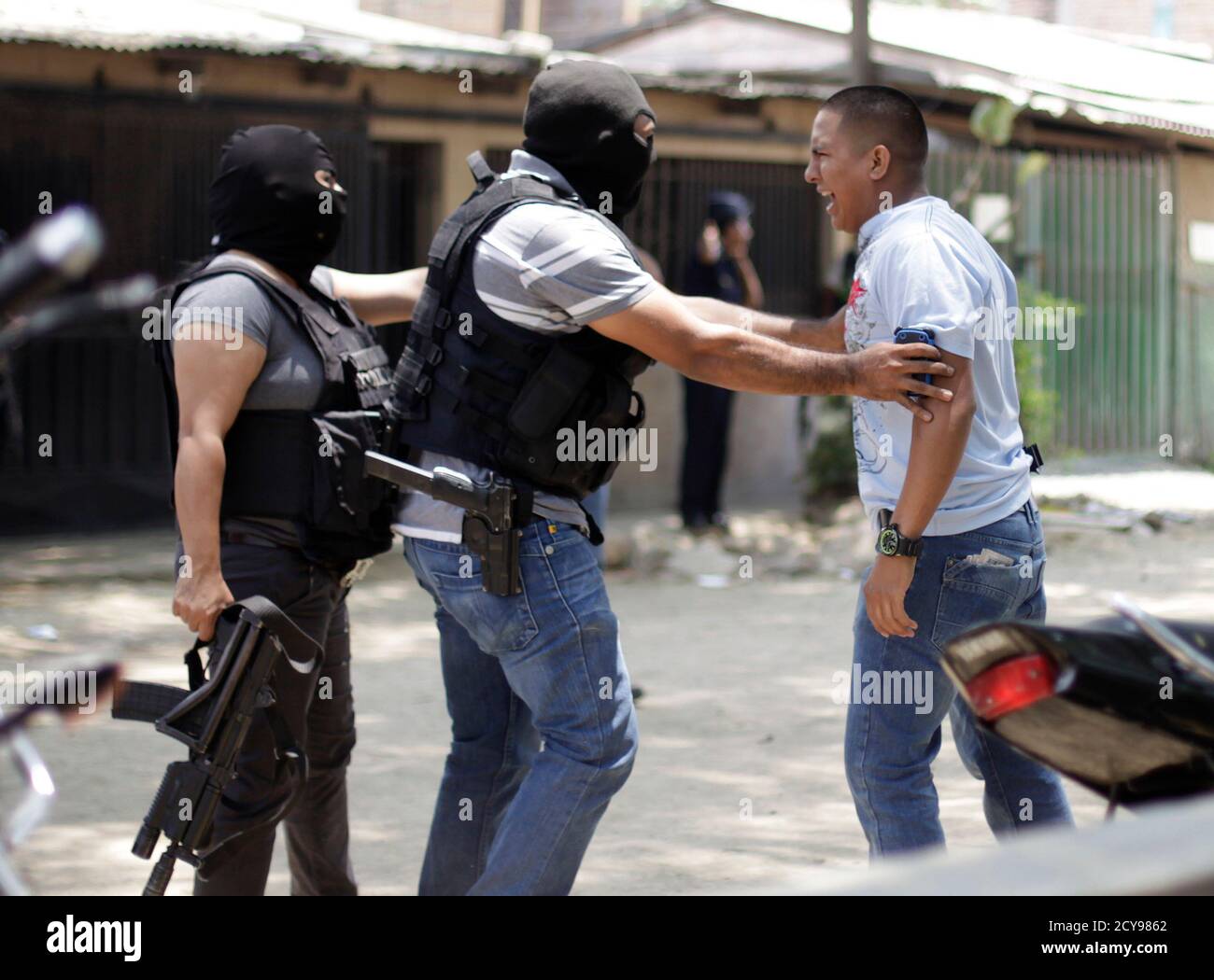 A Body Guard R Who Escaped An Armed Attack Unharmed Reacts At The Crime Scene Where His Colleagues A 17 Year Old School Girl And Four Other People Were Shot Dead In Tegucigalpa