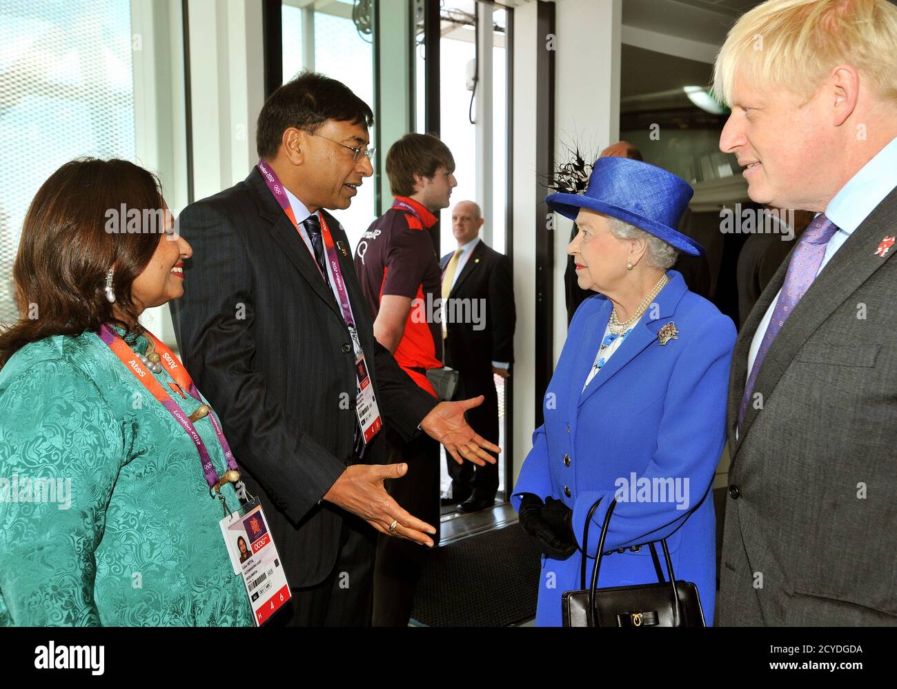 Britain's Queen Elizabeth, accompanied by London Mayor Boris Johnson speaks  with Lakshmi Mittal (2nd L) and his wife Usha (L), during her visit to the  top of the Orbit at the Olympic