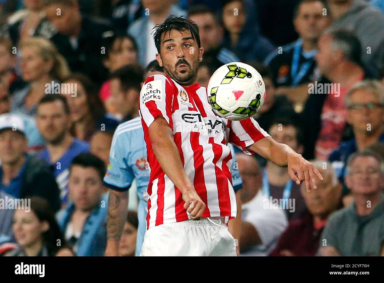 Former Spain striker David Villa, playing for Melbourne City football club,  uses his chest to stop the ball during the A-League soccer game against  Sydney FC at the Sydney Football Stadium October