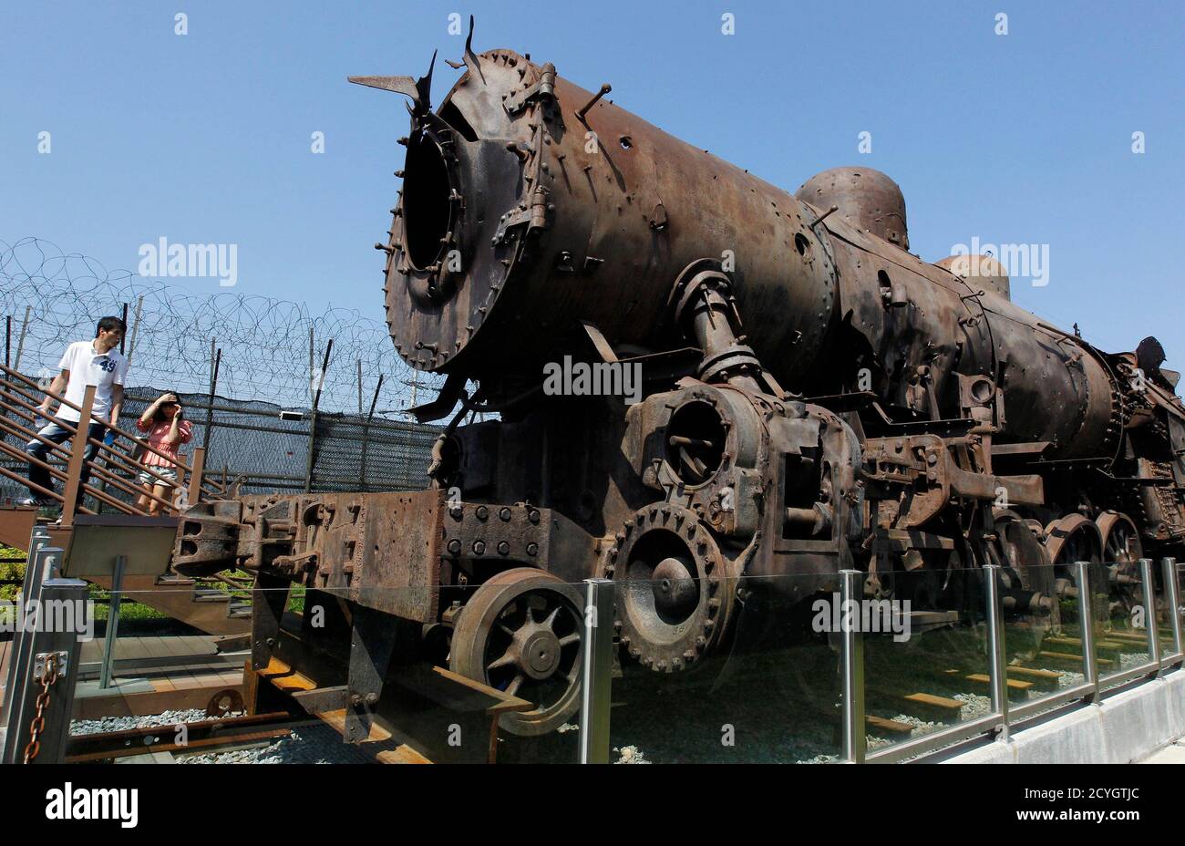 Visitors Look At A Bullet Riddled Steam Locomotive Named Cheol Ma Meaning Iron Horse On Display At Imjingak Pavilion Near The Demilitarized Zone Dmz Separating The Two Koreas In Paju About 52 Km