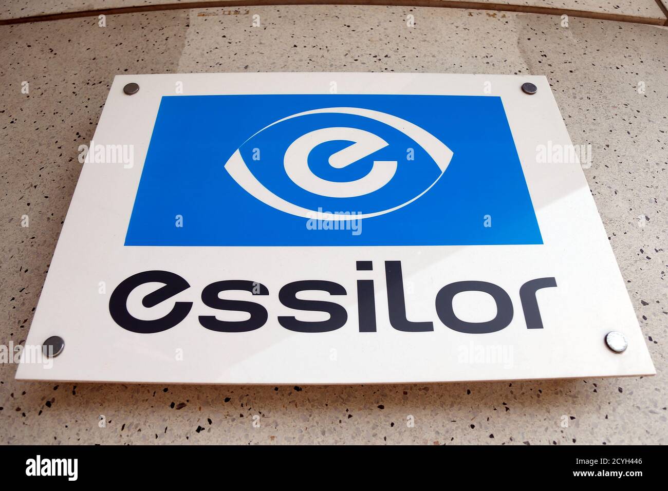 The logo of Essilor, the world's largest maker of ophthalmic lenses, is  seen on the front of the company marketing headquarters in Vincennes near  Paris August 29, 2013. Essilor trimmed its full-year