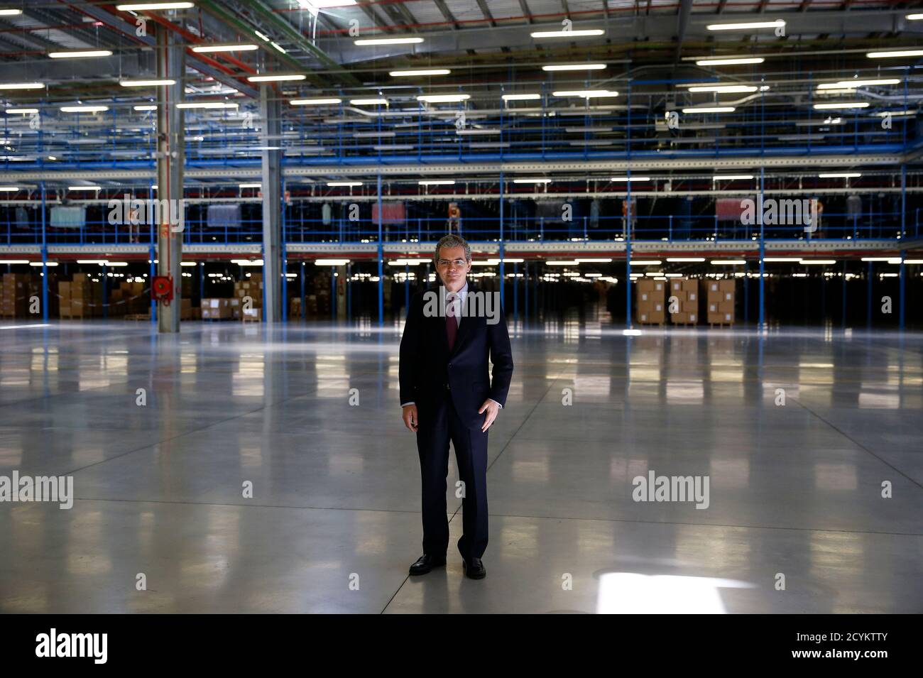 Inditex Chairman and CEO Pablo Isla poses for a picture at a distribution  center outside Meco, near Madrid March 19, 2014. Strong sales so far this  year and a planned pick up
