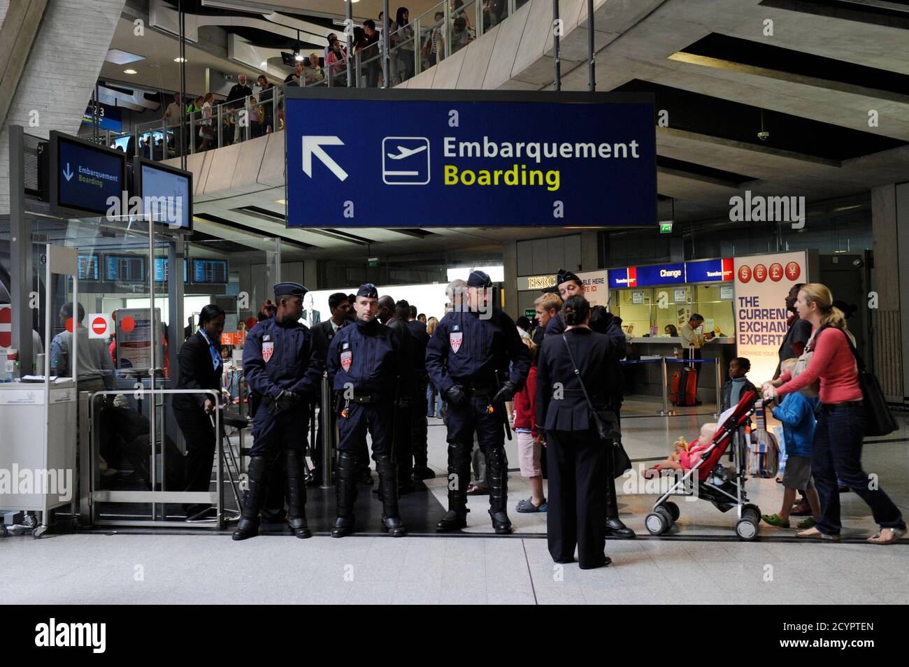 French police stand guard next to a gate at Charles-de-Gaulle airport in  Roissy near Paris July 8, 2011. A Hungarian airline stopped dozens of  French activists heading for a pro-Palestinian "fly-in" in
