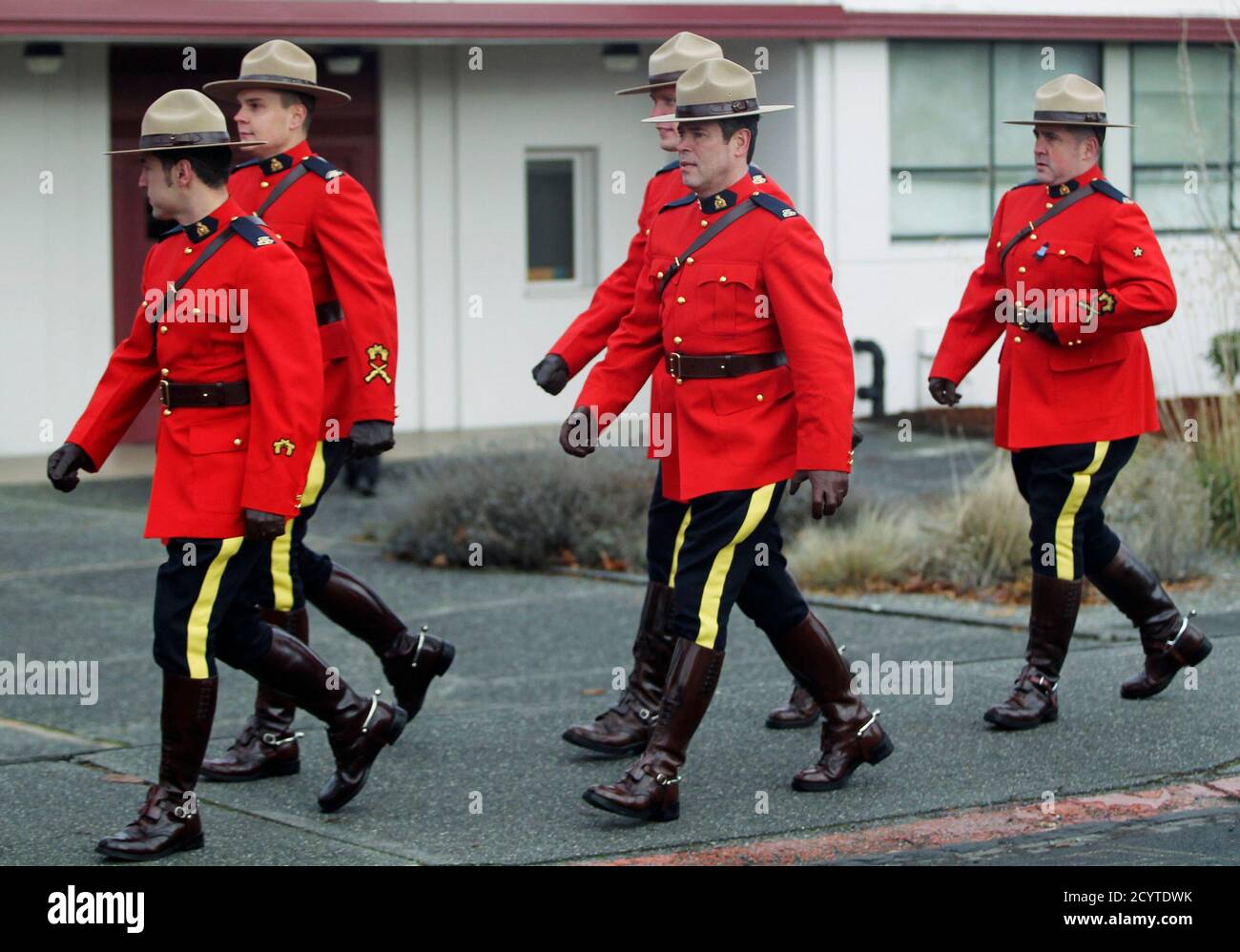 Royal Canadian Mounted Police officers arrive at Pacific Lutheran  University in Tacoma, Washington January 10, 2012, where law enforcement  officers from the U.S. and Canada have gathered for a memorial service for