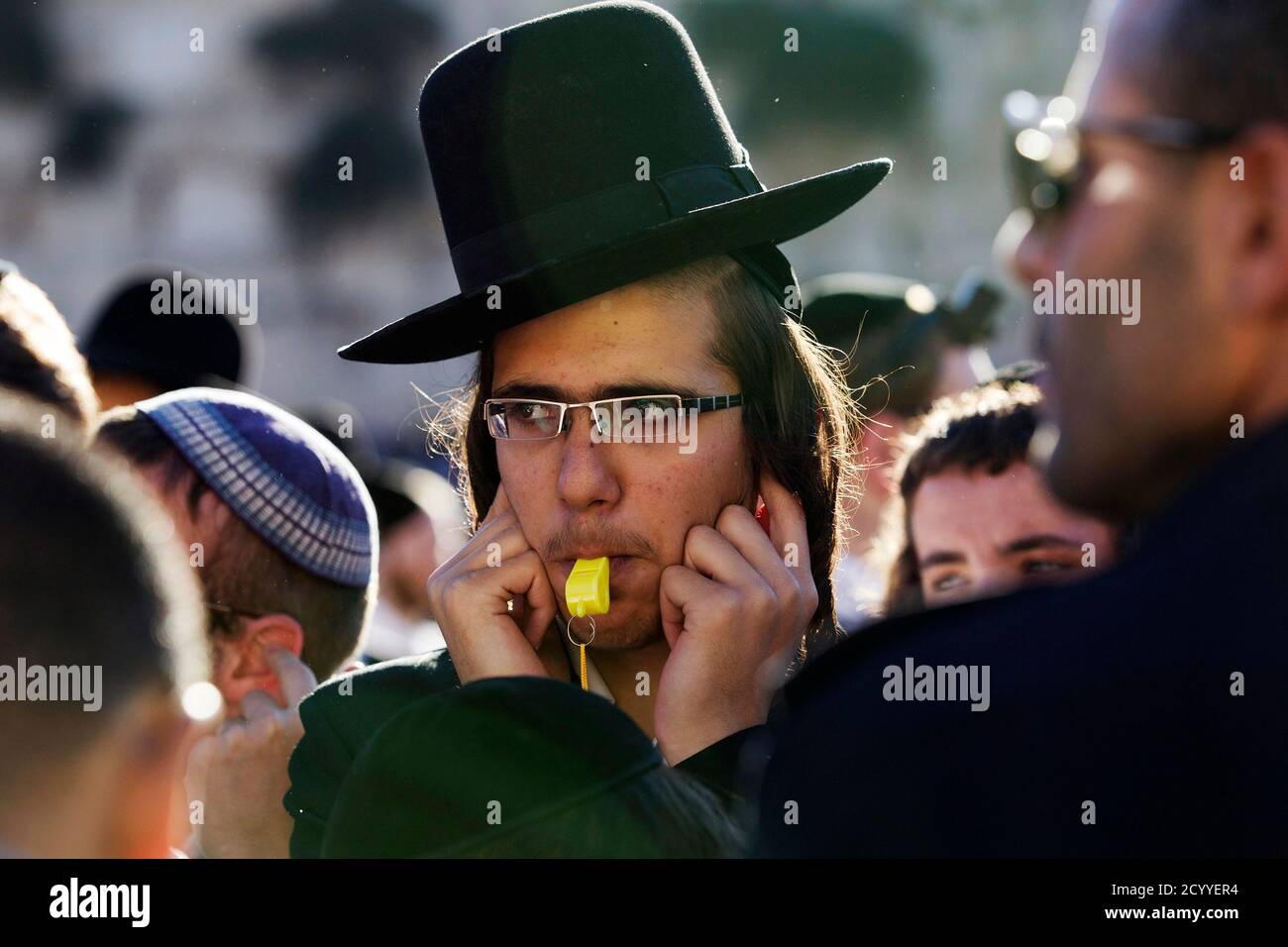 An ultra-Orthodox Jewish man blows a whistle as he protests against Jewish  female activists from the Women of the Wall prayer rights group (not  pictured) who are holding a monthly prayer session