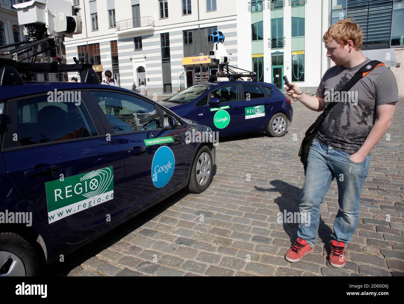 A Man Takes A Picture Of Google S Street View Cars During A Media Event In Riga August 26 2011 Google Has Started Capturing Images Of Several Cities In Latvia To Operate Its