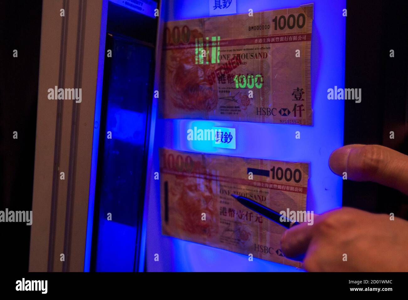 An authentic HK$1,000 ($129) banknote sample is displayed above a ...
