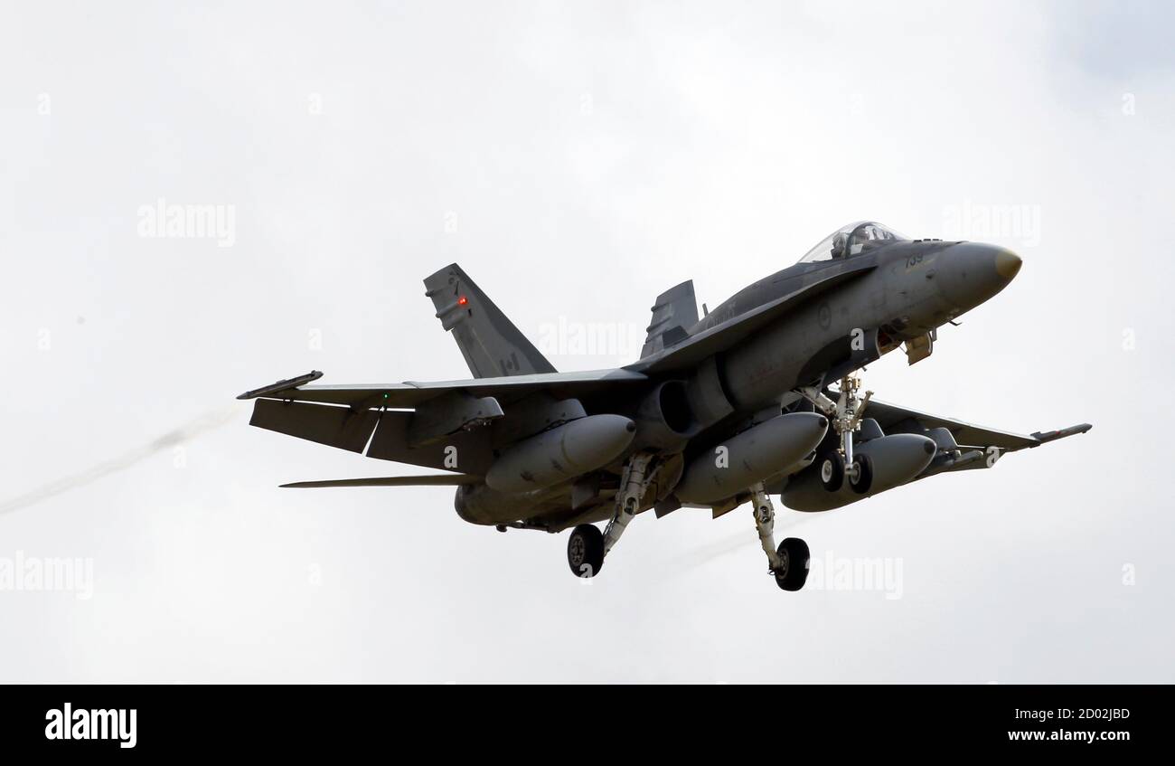 A Canadian CF-18A fighter plane prepares to land at the Birgi NATO Airbase  in Trapani in the southern Italian island of Sicily March 19, 2011. Canada  backs the idea of taking swift