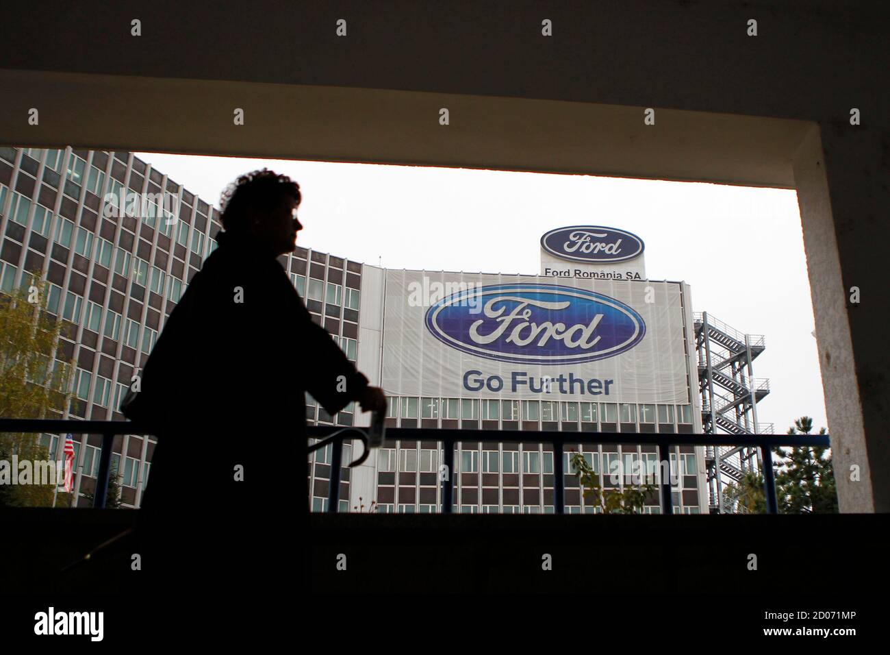A worker leaves the Ford car plant in Craiova, 230km (143 miles) west of  Bucharest, October 29, 2012. Ford will stop making vans in Britain next  year, cutting 1,400 jobs on top