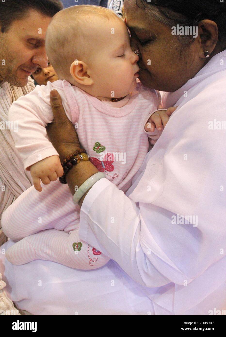 Mata Amritanandamayi Of India Better Known As Amma The Hugging Saint Embraces A Follower During The New York Stop Of Her 10 City U S Tour July 16 05 Considered A Living Saint In Her