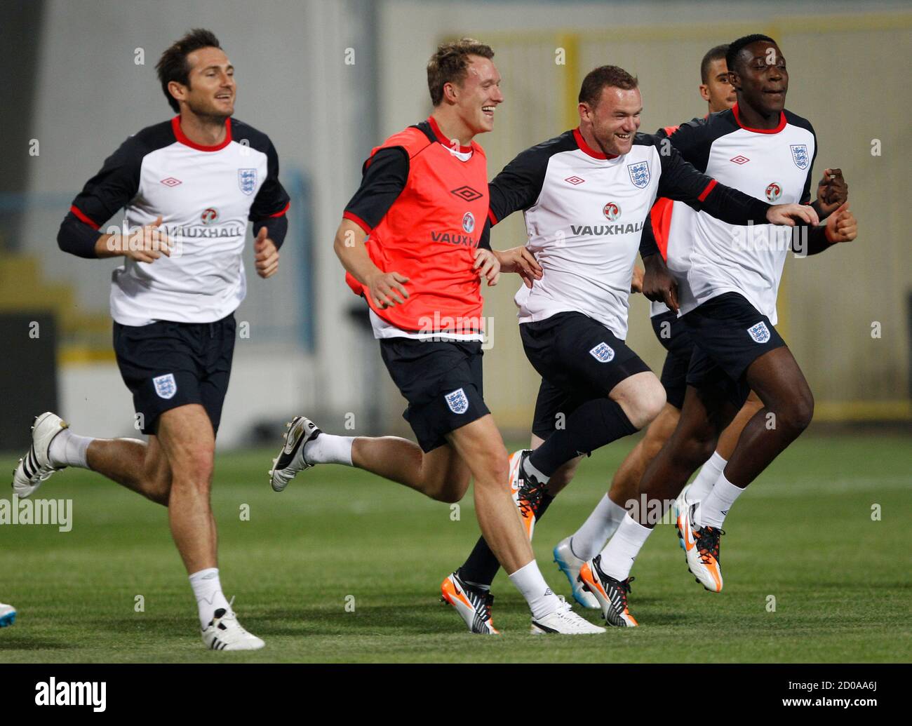 England S Wayne Rooney 2nd R Races Phil Jones 2nd L And Danny Welbeck R During A Training Session In Podgorica October 6 11 England Are Due To Play Montenegro In A Euro